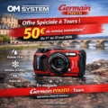Offre Olympus TG7 Mai 2026 → Germain Photographie Promotional banner for Germain Photo Tours advertising a 50€ immediate rebate on tours, featuring a red OM System camera by a river and cityscape backdrop. → Germain Photographie